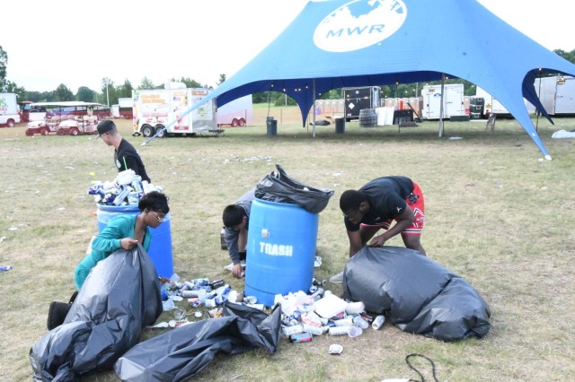 Better Opportunity for Single Soldiers volunteers help cleanup operation on Division Hill to restore it back to normal June 27, the morning after Mountainfest 2025. (Photo by Mike Strasser, Fort Drum Garrison Public Affairs)