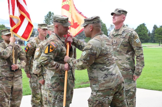 Command Sgt. Maj. Jason R. Mortensen relinquishes responsibility of U.S. Army Garrison Fort Carson to Command Sgt. Maj. Travis A. Manuel June 27, 2025 at Founders’ Field on Fort Carson. Col. Erik C. Oksenvaag, commander of U.S. Army Garrison...
