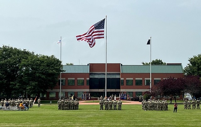 Fort Detrick Soldiers stand in formation on Blue & Gray parade field as the bugle sounds and the nation’s colors are lowered during a Retreat Ceremony to officially mark the end of the day&#39;s Army birthday celebrations, July 13.