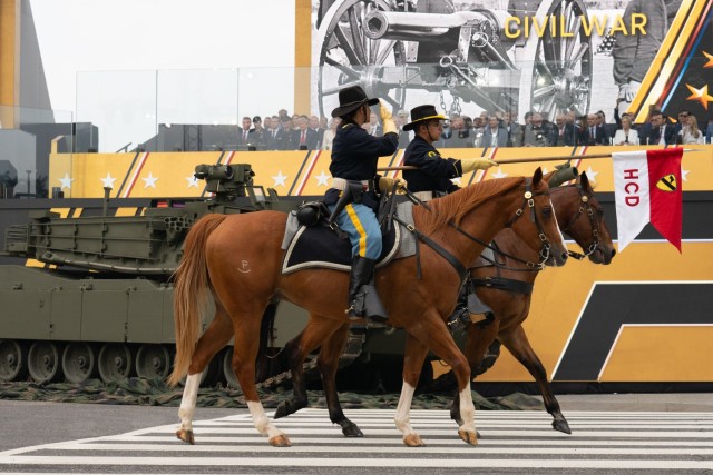 U.S. Army Soldiers assigned to the 1st Cavalry Division Horse Detachment, salute President of the United States Donald J. Trump during the pass in review portion of the 250th Army Birthday Parade June 14, 2025, in Washington, D.C. The parade...