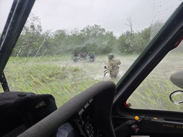 Alaska Army National Guard Chief Warrant Officer 3 Nick Lime, an aviator assigned to 207th Aviation Battalion, assists six distressed people stranded on the Kuskokwim River during a rescue mission June 30, 2025. The Alaska Rescue Coordination...