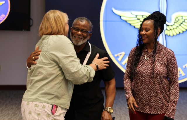 Friends congratulate CSM (R) Otis Smith on his 50 years of federal service at a ceremony in his honor at Fort Rucker on July 2, 2025.