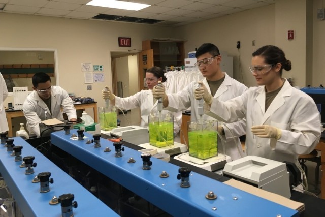 Cadets test for optimal chemical dosing to determine the best conditions for treating drinking water.
