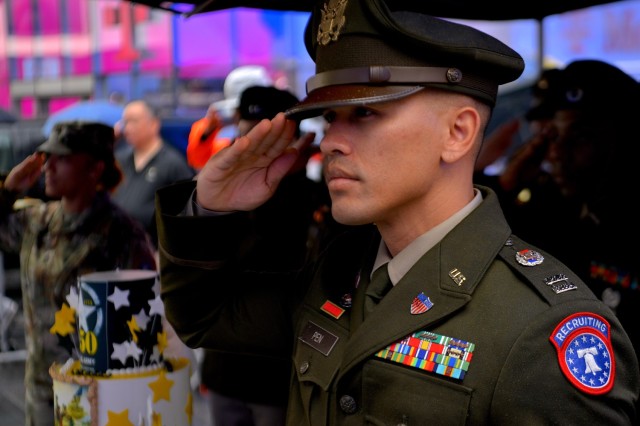 A U.S. Army recruiter with the U.S. Army New York City Recruiting Battalion renders a salute during a celebration of the Army’s 250th Birthday in Times Square, New York on June 14, 2025. More than 250 soldiers, government officials, and...