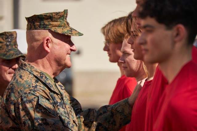 U.S. Marine Corps Maj. Gen. Robert B. Sofge Jr., commanding general of Marine Corps Forces Europe and Africa, speaks with poolees with Recruiting Substation Europe after an oath of enlistment ceremony on U.S. Army Garrison Panzer Kaserne,...