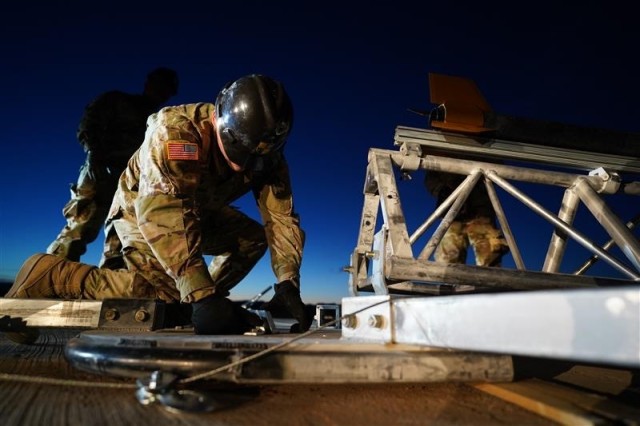 Cadets set up a launch rail as part of their hypersonic rocket capstone