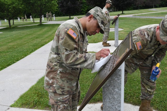Debris is removed from each memorial plaque as Soldiers with 1st Brigade Combat Team, 10th Mountain Division (LI), ensure that Memorial Park is ready to welcome Gold Star family members and invited guests June 25 for the Annual Remembrance...
