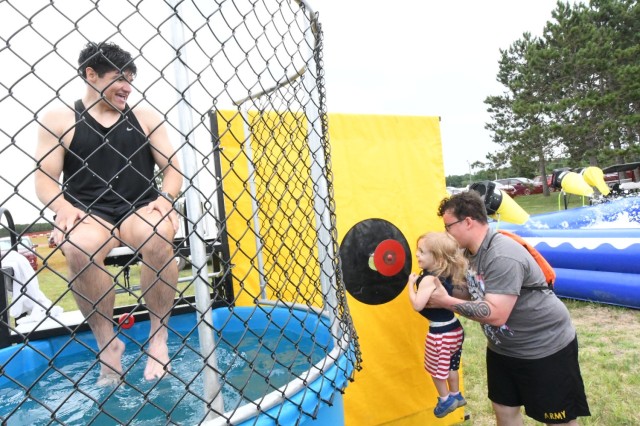 Fort Drum community members normally would see Chris Franklin, FMWR recreation assistant, at Monti Physical Fitness Center, but he took the plunge (lots of them) to support the community during Mountainfest on Division Hill. (Photo by Mike...