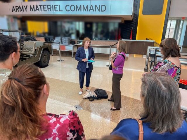 (From left) Long-time U.S. Army Security Assistance Command Pubic Affairs Director Kim Capehart is recognized by Kim Hanson, Army Materiel Command&#39;s Deputy Director, Public & Congressional Affairs, at AMC Headquarters on Redstone Arsenal June...