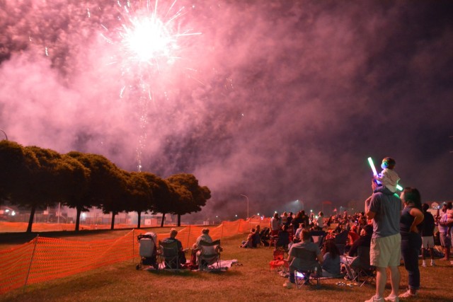 Spectators watch fireworks.