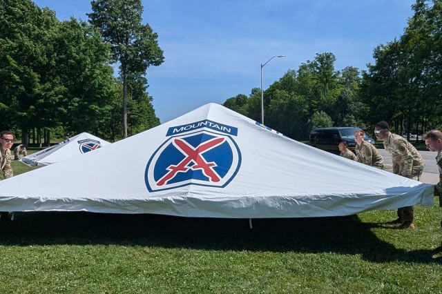 Dozens of 10th Mountain Division (LI) Soldiers set up and rehearse the Annual Remembrance Ceremony in Memorial Park, which includes a color guard, wreath-laying, and a three-volley salute firing party. The ceremony honors the service and...