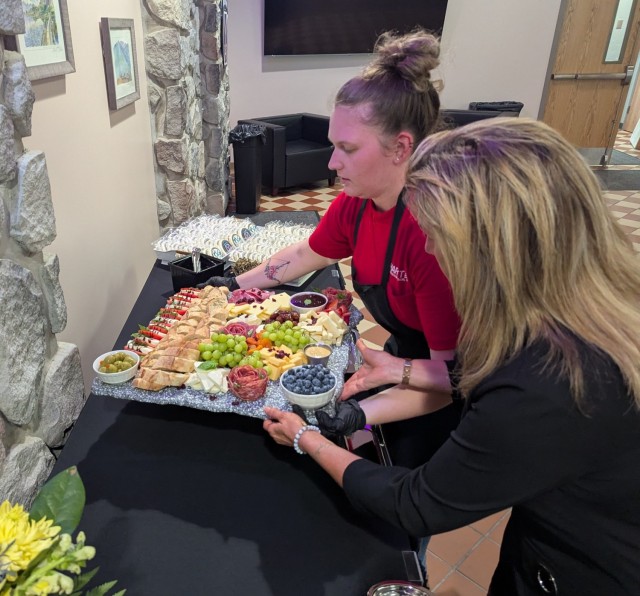 Fort Drum Family and Morale, Welfare and Recreation staff at The Ridge prepare food and drinks for attendees June 24 during the Gold Star evening social at Fort Drum. (Photo by Mike Strasser, Fort Drum Garrison Public Affairs)