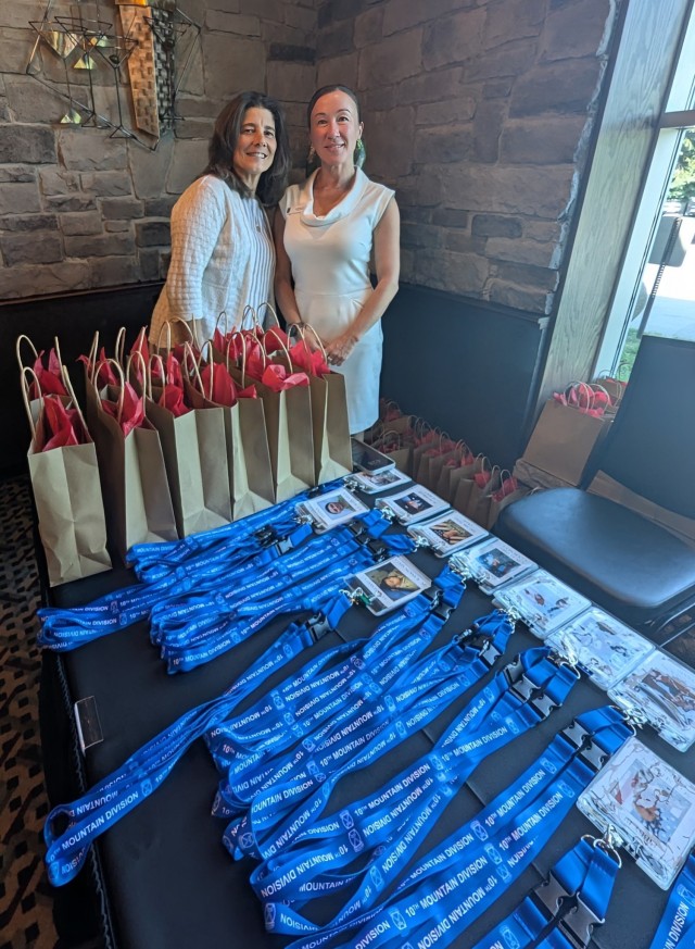 Michelle Foster, chief of protocol, and Susan Walling, Gold Star coordinator, prepare to greet guests at the Gold Star evening social June 24 during Mountainfest week at Fort Drum. (Photo by Mike Strasser, Fort Drum Garrison Public Affairs)