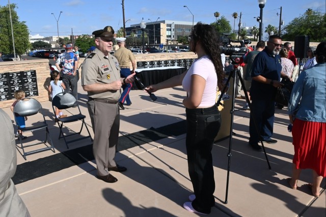 U.S. Army Yuma Proving Ground commander Col. John Nelson (left) is interviewed by KYMA-TV at the Caballeros de Yuma’s 39th annual Fourth of July Flag Raising Ceremony at Armed Forces Park on July 4, 2025.