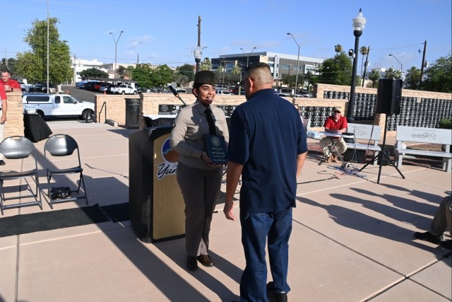 U.S. Army Yuma Proving Ground Soldier of the Year Spc. Hardi Patel receives a plaque from the Yuma Military Affairs Council presented by Yuma City Councilman Mark Martinez at the Caballeros de Yuma’s 39th annual Fourth of July Flag Raising...