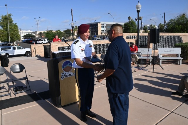 U.S. Army Yuma Proving Ground Non-Commissioned Officer of the Year Staff Sgt. Angel Viveros of YPG’s elite Airborne Test Force is receives a plaque from the Yuma Military Affairs Council presented by Yuma City Councilman Mark Martinez at the...