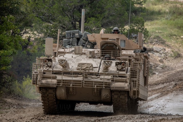 Soldiers from 4th Squadron, 9th U.S. Cavalry Regiment "Dark Horse," 2nd Armored Brigade Combat Team, 1st Cavalry Division, drive through a low-water crossing in the Armored Multi-Purpose Vehicle (AMPV) after completing field testing on Fort Hood,...