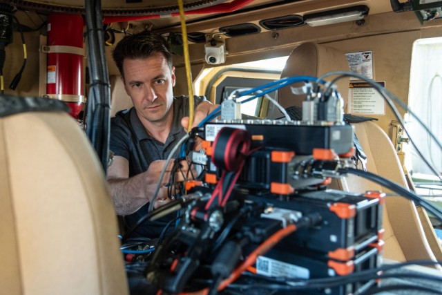 Bernard Duplan, a senior engineer and vehicle dynamics expert at the U.S. Army Aberdeen Test Center, verifies instrumentation connections before a vehicle test. Data is an important product of testing as it explains what a vehicle is doing, how...