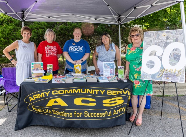 Army Community Service staff members celebrate the program’s 60th birthday at Fort Knox, Kentucky, July 7, 2025. The early celebration featured free children’s books and popsicles as well as information on ACS resources. The ACS program’s...