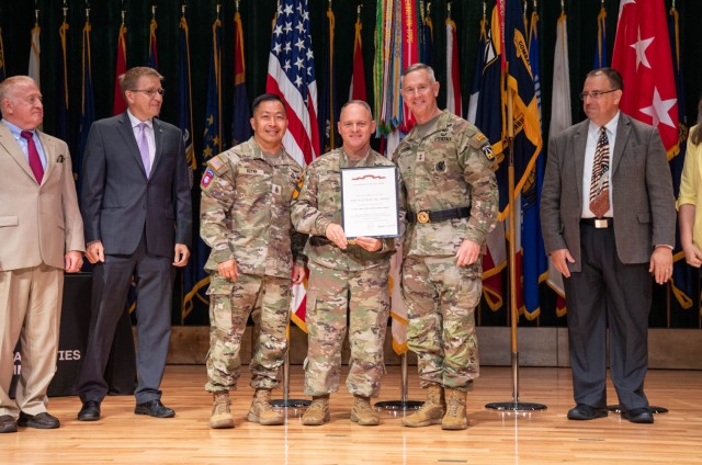 Lt. Gen. Miles Brown, Army Futures Command deputy commanding general, center, Maj. Gen. John Cushing, U.S. Army Combat Capabilities Development Command, or DEVCOM, commanding general, right, and Command Sgt. Maj. Thinh Huynh, DEVCOM senior...