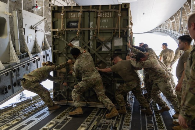 Soldiers from the 1st Battalion, 14th Field Artillery Regiment (1-14th FAR) load equipment and vehicles onto a C-17 aircraft as part of Strategic Airlift (STRATAIR) operations at the Lawton Regional Airport June 30, 2025. 1-14th FAR deployed to...