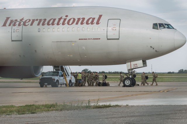 Soldiers assigned to 1st Battalion, 14th Field Artillery Regiment (1-14th FAR), 75th Field Artillery Brigade, loaded onto an airplane for their deployment to Grafenwoehr, Germany, in Fort Sill, Oklahoma, June 28, 2025. 1-14th FAR stands ready to...