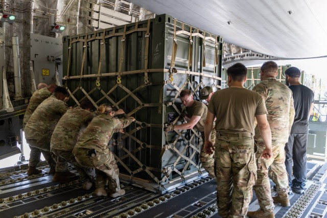 Soldiers from the 1st Battalion, 14th Field Artillery Regiment (1-14th FAR) load equipment and vehicles onto a C-17 aircraft as part of Strategic Airlift (STRATAIR) operations at the Lawton Regional Airport June 30, 2025. 1-14th FAR deployed to...