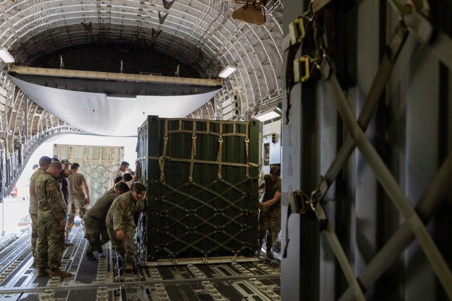 Soldiers from the 1st Battalion, 14th Field Artillery Regiment (1-14th FAR) load equipment and vehicles onto a C-17 aircraft as part of Strategic Airlift (STRATAIR) operations at the Lawton Regional Airport June 30, 2025. 1-14th FAR deployed to...