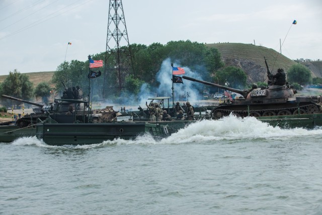 U.S. Soldiers assigned to 7th Engineer Brigade, 21st Theater Sustainment Command, transports Italian VBM Freccia at a wet gap crossing during exercise Saber Guardian 25 in Frecatei, Romania, June 12, 2025. Saber Guardian 25 is an exercise co-led...