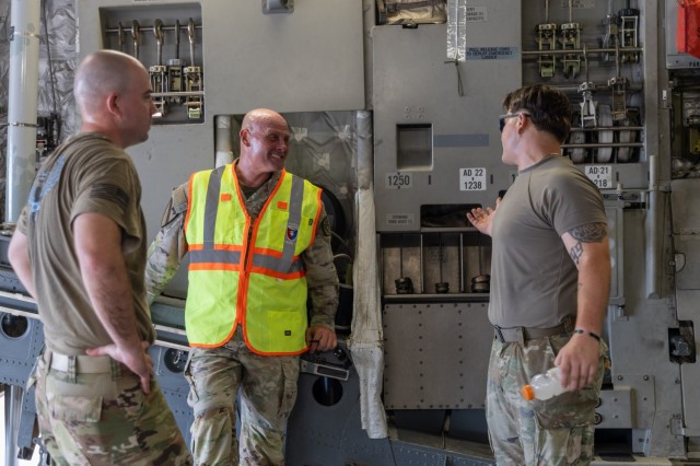 Maj. Gen. Winston Brooks (center), the Fires Center of Excellence Commander, talks with a Soldier assigned to the 1st Battalion, 14th Field Artillery Regiment during Strategic Airlift (STRATAIR) operations at the Lawton Regional Airport June 30,...
