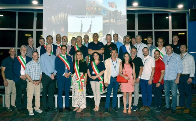 VICENZA, Italy – U.S. and Italian leaders pose for a group photo during the annual Mayors’ Summit, held at Caserma Ederle’s Arena July 3, 2025. More than 90 Italian officials and guests attended the event hosted by the garrison....