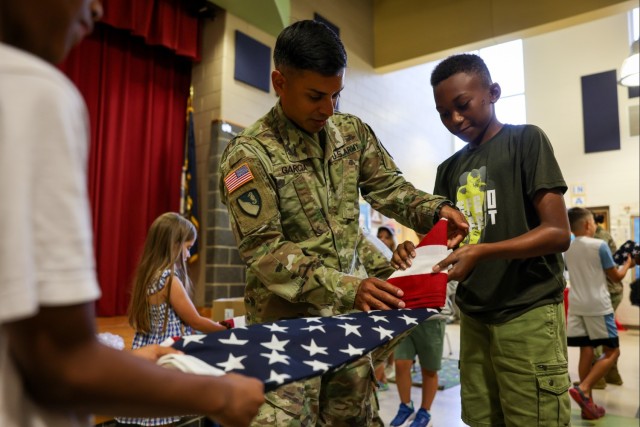 Fort Lee Funeral Honors Team Demonstrate Flag Folding to Youth