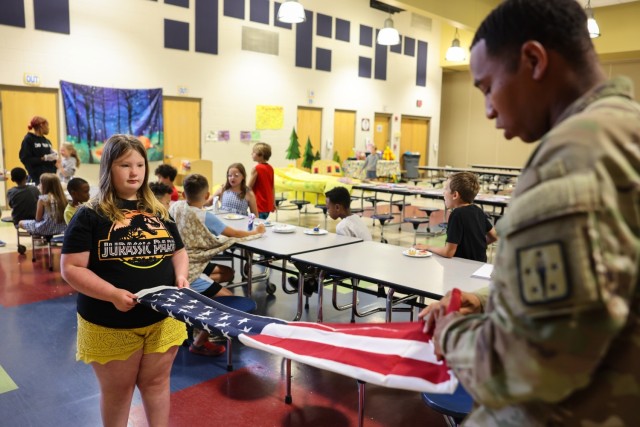 Fort Lee Funeral Honors Team Demonstrate Flag Folding to Youth