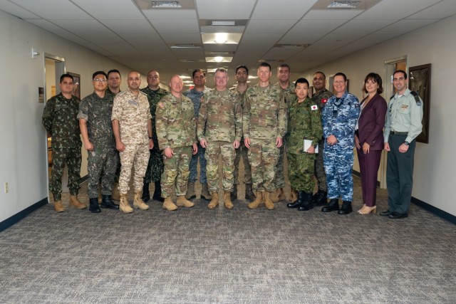 Army Materiel Command Deputy Commanding General and Acting Commander Lt. Gen. Chris Mohan, U.S. Army Security Assistance Command Commanding General Brig. Gen. Allen Pepper and Command Sgt. Maj. Michael Cordery stand for a group photo with...