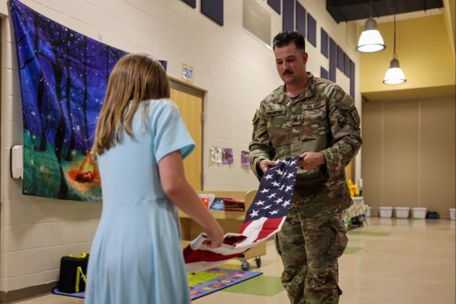 Fort Lee Funeral Honors Team Demonstrate Flag Folding to Youth