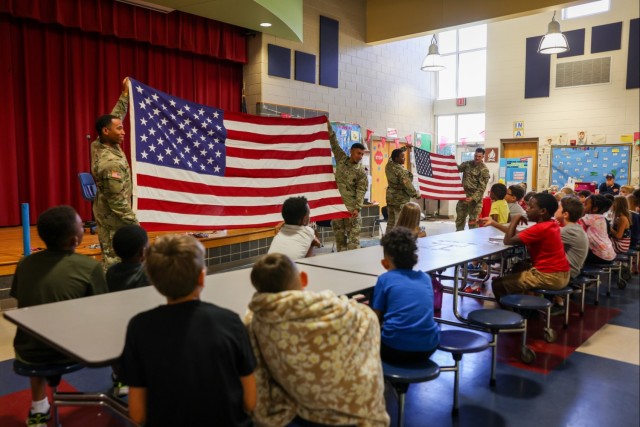 Fort Lee Funeral Honors Team Demonstrate Flag Folding to Youth