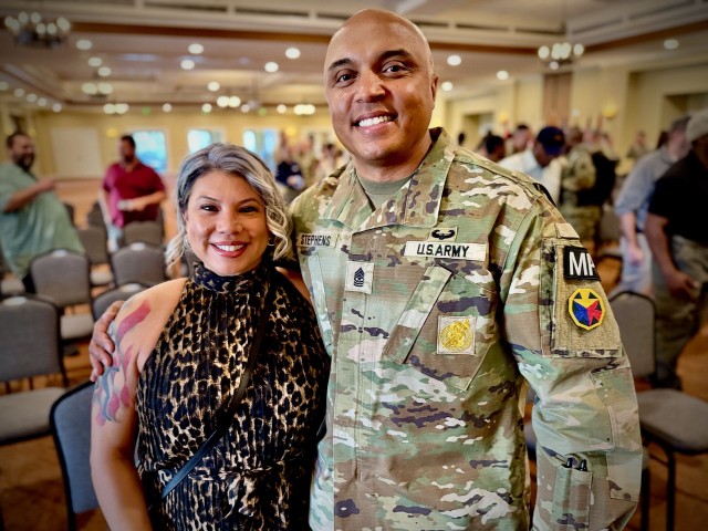 Command Sgt. Maj. Jerald J. Stephens poses with his spouse during the Fort Irwin Garrison Change of Responsibility ceremony, 10 July 2025, where he relinquished the duty and returns to the Fort Irwin Department of Emergency Services.