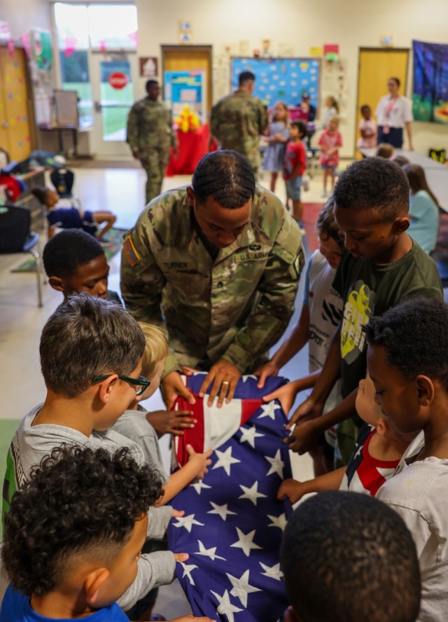 Fort Lee Funeral Honors Team Demonstrate Flag Folding to Youth