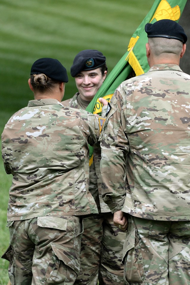 Incoming Midwest Joint Regional Correctional Facility Battalion (Corrections) Command Sgt. Maj. Nickie Wileman accepts the colors from MWJRCF Battalion Commander Lt. Col. Laura Proffit during her change of responsibility ceremony with outgoing...