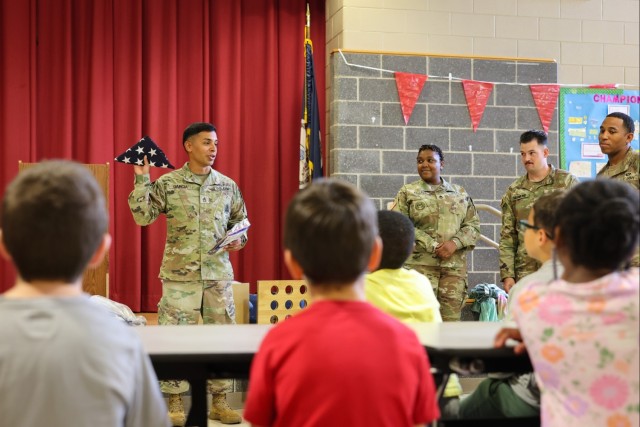 Fort Lee Funeral Honors Team Demonstrate Flag Folding to Youth