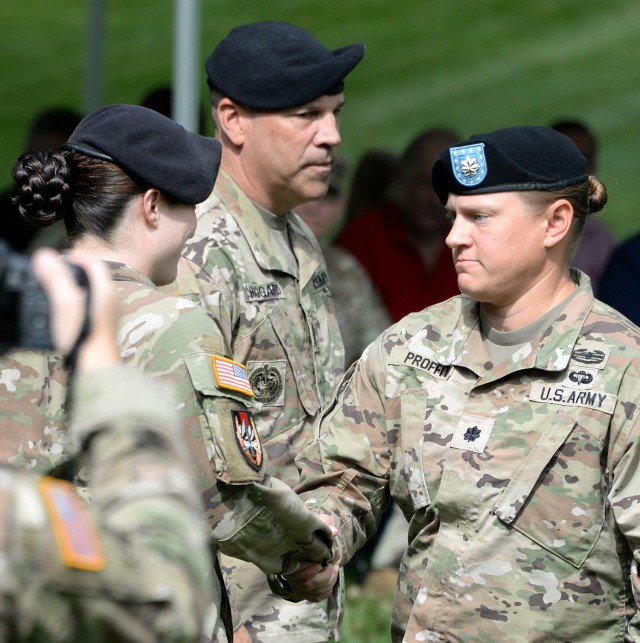 Midwest Joint Regional Correctional Facility Battalion Commander Lt. Col. Laura Proffit, right, welcomes incoming MWJRCF Battalion (Corrections) Command Sgt. Maj. Nickie Wileman during her change of responsibility ceremony with outgoing Midwest...