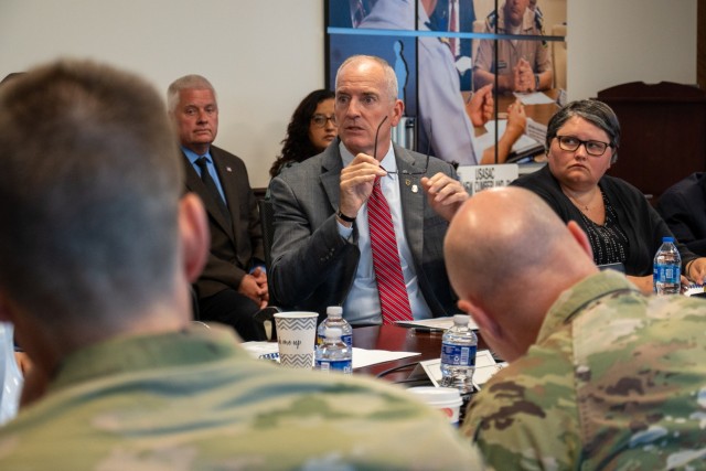 Marv Whitaker, operations fusion center director for the U.S. Army Security Assistance Command, briefs Lt. Gen. Chris Mohan, Army Materiel Command’s deputy commanding general and acting commander, during an organizational update in New...