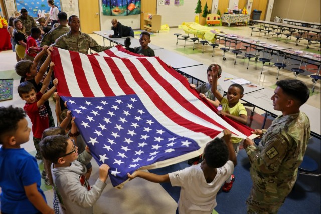 Fort Lee Funeral Honors Team Demonstrate Flag Folding to Youth