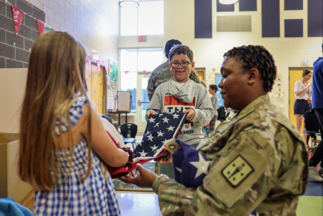 Fort Lee Funeral Honors Team Demonstrate Flag Folding to Youth