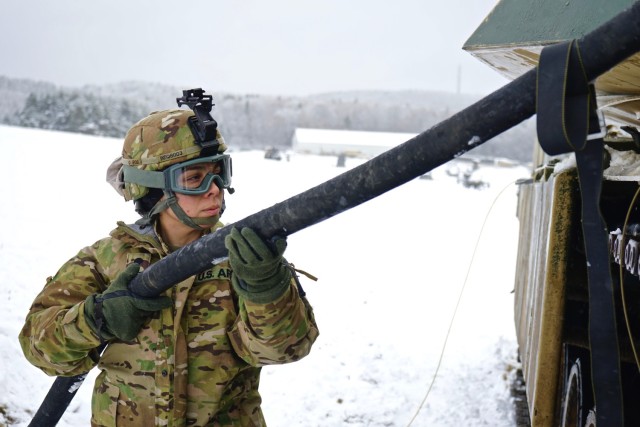 Spc. Nairym Quintero, a petroleum supply specialist with Company E, 2nd General Support Aviation Battalion, 227th Aviation Regiment, 1st Air Cavalry Brigade, 1st Cavalry Division, assists with fueling a 1st Battalion, 18th Infantry Regiment, 2nd...