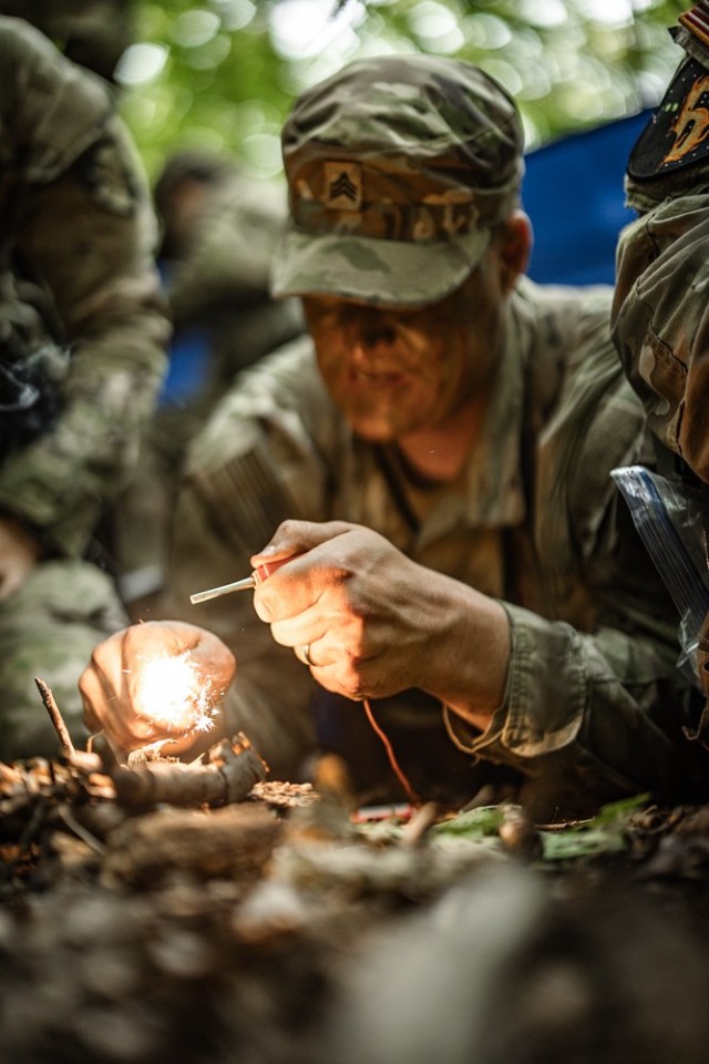 Cadets learn how to start a fire while receiving survival instruction from task force soldiers from the 101st Airborne Division June 10 during Cadet Summer Training. Photo by Jorge Garcia/ USMA-PAO.