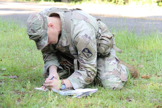 Staff Sgt. Jared Lollar, a drill sergeant at 128th Aviation Brigade, (Joint Base Langley-Eustis, Va.), competes in the land navigation portion of the Aviation Center of Excellence 2025 Drill Sergeant of the Year competition at Fort Rucker, Ala.,...