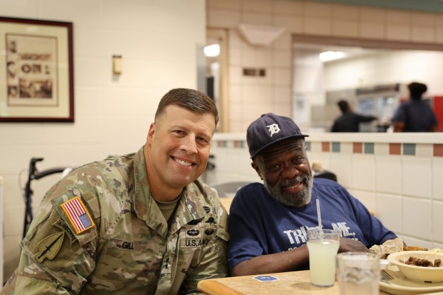 Maj. Gen. Clair Gill, commanding general of the US Army Aviation Center of Excellence and Fort Rucker poses with a veteran from the Command Sgt Maj Bennie G. Adkins State Veterans Home during the Legacy Lunch event held at the Dining Facility on...