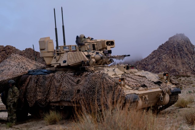 M2A3 Bradley Fighting Vehicle assigned to 1st Armored Brigade Headquarters and Headquarters Company, 1st Armored Brigade Combat Team, 1st Armored Division, pulls security at the National Training Center, Fort Irwin, California, Feb. 6, 2024.