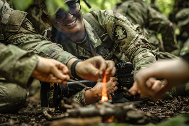 Cadets learn how to start a fire while receiving survival instruction from task force soldiers from the 101st Airborne Division June 10 during Cadet Summer Training. Photo by Jorge Garcia/ USMA-PAO.